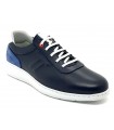 Zapatos de piel en color azul con la suela blanca