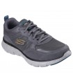 Deportivo Skechers en color gris con cierre de cordones.