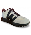 Deportivos blancos con cordones y logo negro. Piel natural.