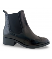 Botines estilo Chelsea con elásticos en negro.